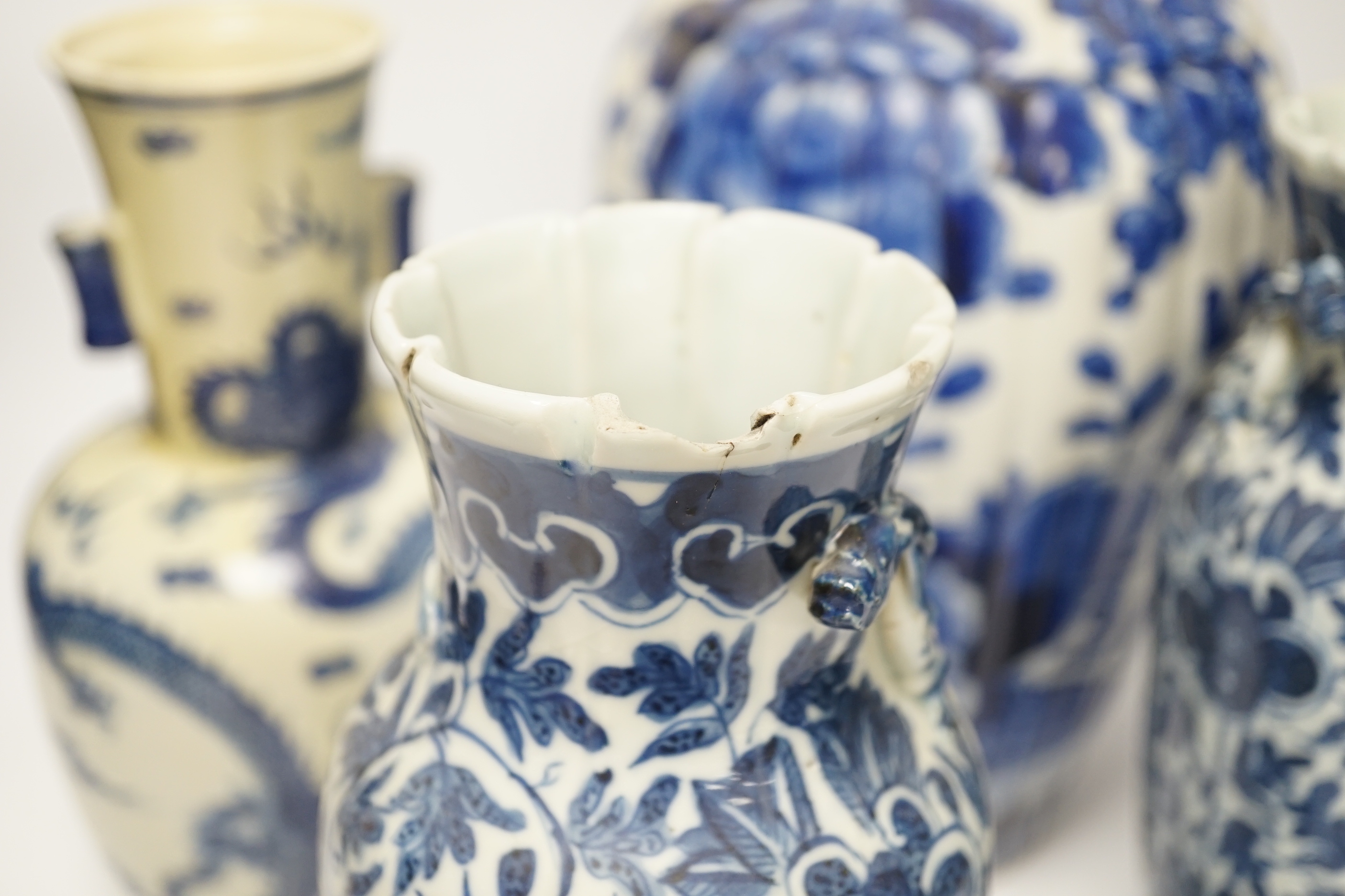 Three 19th century Chinese blue and white vases including a floral pair and a Japanese vase, largest 39cm high